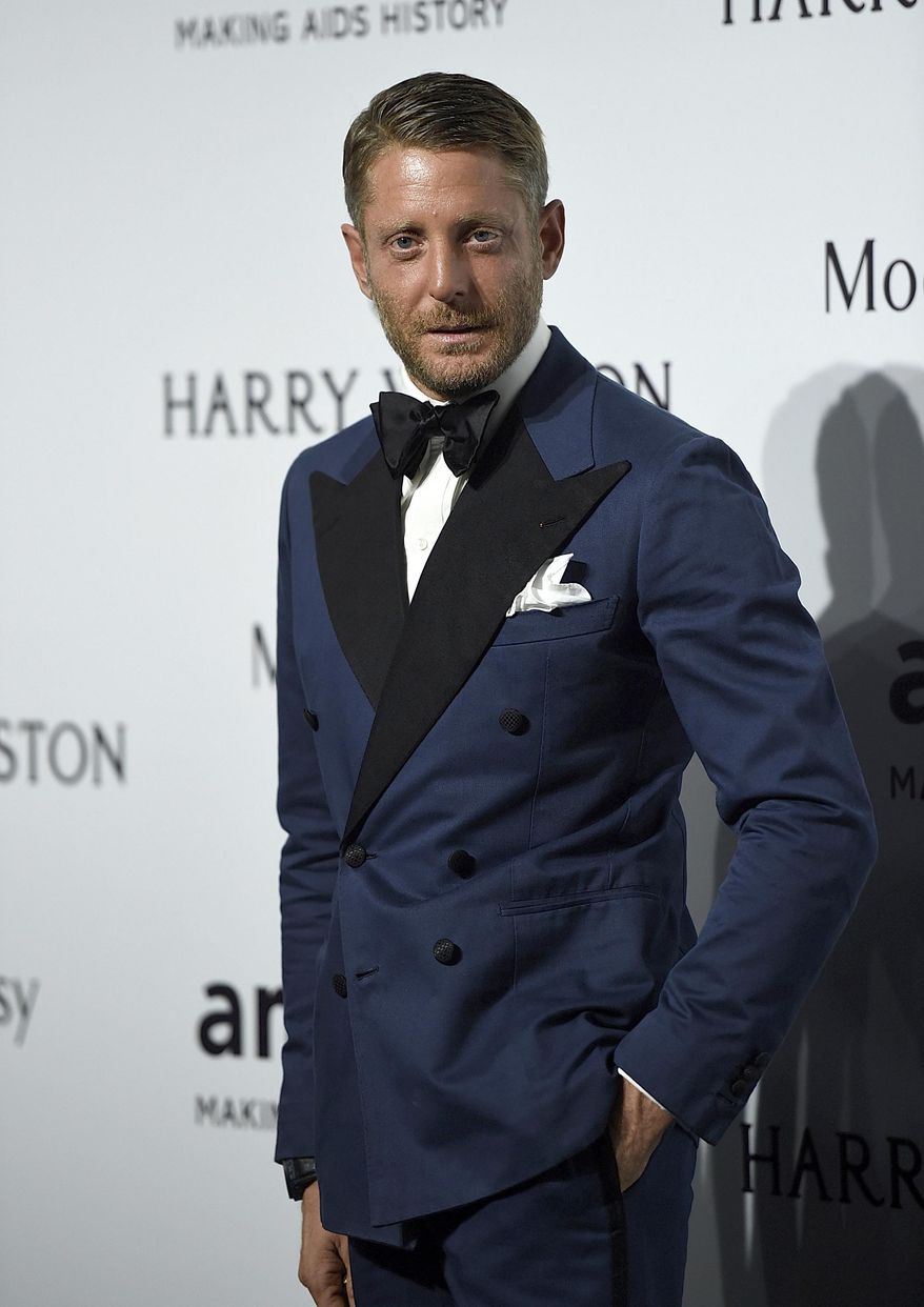 FILE - In this Sept. 26, 2015 file photo, Lapo Elkann arrives for an amfAR charity dinner in Milan, Italy. A criminal charge by the Manhattan district attorney has been dropped against the playboy grandson of the Italian founder of Fiat Automobiles who had been accused of filing a false report when he claimed he was being held against his will in New York City. The 39-year-old was arrested outside a public housing project in December 2016 after his family contacted police, saying he needed $10,000 to guarantee his safety. But authorities say he made up the story after he ran out of money following a two-day binge with an escort. (AP Photo/Giuseppe Aresu, File)