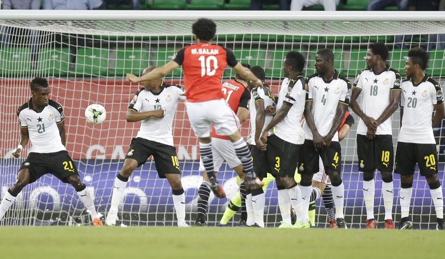 Egypt&#39;s Mohamed Salah, front, scores a goal during the African Cup of Nations Group D soccer match between Egypt and Ghana at the Stade de Port-Gentil, Gabon, Wednesday Jan. 25, 2017. (AP Photo/Sunday Alamba)