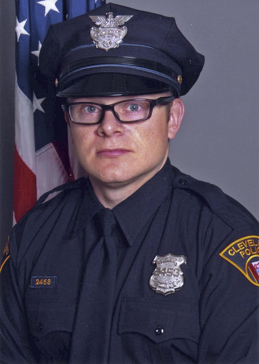 This undated photo provided by the city of Cleveland's Division of Police shows Patrolman David Fahey, who authorities say was struck and killed Tuesday, Jan. 24, 2017, by a hit-and-run driver as Fahey placed road flares near two auto accidents on Interstate 90 in Cleveland. Israel Alvarez was arrested later that day in Lorain, Ohio, about 30 miles west of Cleveland, and a police spokeswoman said Wednesday, Jan. 25, 2017, that Alvarez was charged with aggravated vehicular homicide and felony hit-skip. (Cleveland Division of Police via AP)