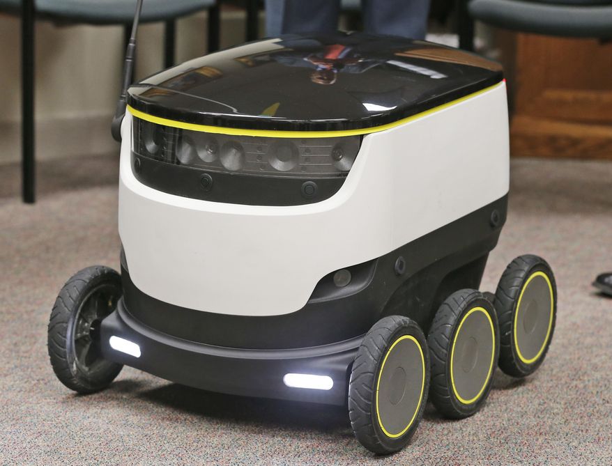 The Starship Technologies delivery robot goes through it's paces during a demonstration at the Capitol in Richmond, Va., Wednesday, Jan. 25, 2017. State lawmakers have partnered with European company Starship Technologies on bills that would allow Virginia cities to join two others in the U.S. and many across Europe where the company is testing the robots. Much like big-time retailers' attempts at drone deliveries, the robots aim to revolutionize the way people get their parcels. (AP Photo/Steve Helber)