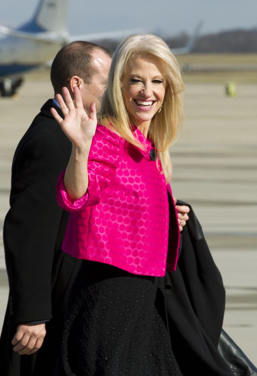 Counselor to President Kellyanne Conway waves to the media before President Donald Trump&#39;s arrival at Andrews Air Force One, Md., Thursday, Jan. 26, 2017. ( AP Photo/Jose Luis Magana)