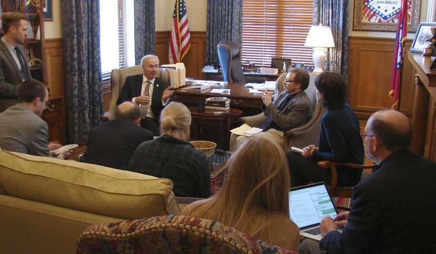 Gov. Asa Hutchinson visits with reporters at his State Capitol office in Little Rock, Arkansas, on Thursday, Jan. 26, 2017, to discuss a bill limiting a common second-trimester abortion procedure. The Arkansas Senate gave the bill final approval Thursday, and Hutchinson said he would sign the bill when it arrives in his office. (AP Photo/Kelly P. Kissel)