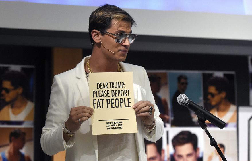 Milo Yiannopoulos holds a sign as he speaks at the University of Colorado campus in Boulder, Colo., Wednesday, Jan. 25, 2017. Yiannopoulos is an editor at the alt-right website Breitbart News. The alt-right is an offshoot of conservatism mixing racism, white nationalism and populism. (Jeremy Papasso/Daily Camera via AP)