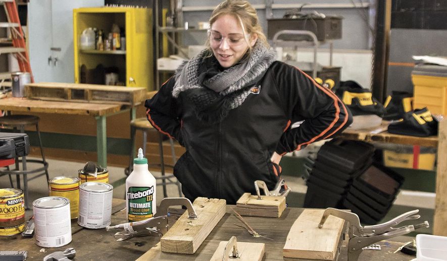 ADVANCE FOR USE SUNDAY, JAN. 29, 2017 AND THEREAFTER - In this Dec. 19, 2016 photo, Prophetstown High School junior Hailey Michelson talks about one of her projects during her agriculture education class at the high school in Prophetstown, Ill. Hailey, is a walking, welding, construction-savvy embodiment of the new-age ag student. She's gone from a budding ag student to aspiring to teach ag to middle school or high school kids. (Michael Krabbenhoeft/Sauk Valley Media via AP)