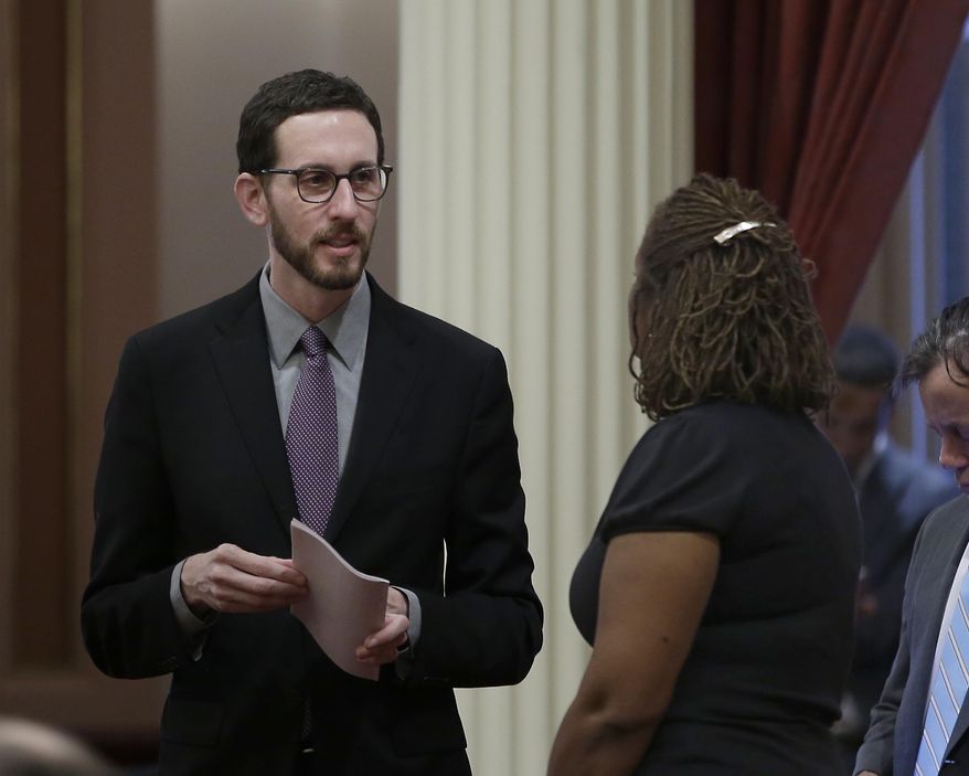 State Sen. Scott Wiener, D-San Francisco, left, talks with Sen. Holly Mitchell, D-Los Angeles, at the Capitol, Thursday, Jan. 26, 2017, in Sacramento, Calif. Wiener, and Sen. Toni Atkins, D-San Diego, introduced legislation on Thursday to add a non-binary gender option on state identifying documents including driver's licenses, birth certificates and identity cards.AP Photo/Rich Pedroncelli)