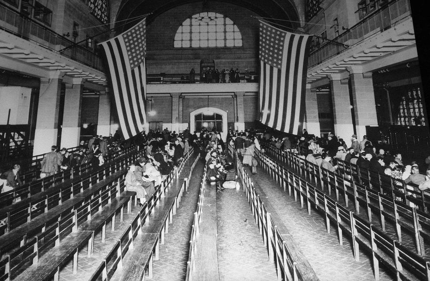 FILE--In this is a 1924 file photo, the registry room at Ellis Island in New York harbor. Immigration to the U.S has come in swells and dips over the past two-plus centuries, driven by shifts in U.S. policy, the mood in the country and world events. Labor shortages, racial tension, economic forces, religious prejudice and national security concerns all fit into the picture. (AP Photo/file)