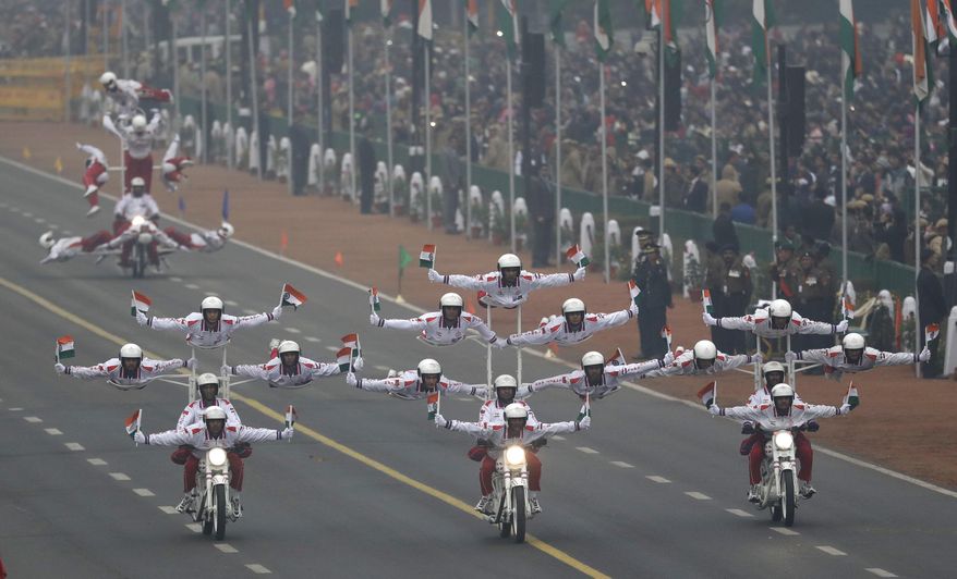 Indian Army daredevils display their skills on motorcycles during Republic Day parade in New Delhi, India, Thursday, Jan. 26, 2017. India celebrates Republic day with parades across the country, showcasing India’s military might and economic strength. (AP Photo/Manish Swarup)