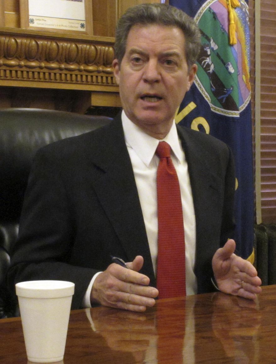 Kansas Gov. Sam Brownback answers questions from reporters about a special election in the 4th Congressional District, Tuesday, Jan. 24, 2017, at the Statehouse in Topeka, Kan. The special selection follows former U.S. Rep. Mike Pompeo's appointment as CIA director and is set for April 11, 2017 (AP Photo/John Hanna)