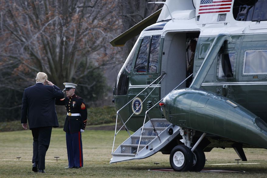 President Donald Trump salutes before boarding Marine One on the South Lawn of the White House in Washington, Thursday, Jan. 26, 2017, for a short trip to Andrews Air Force Base, Md., then onto Philadelphia for the Republican Congressional retreat. (AP Photo/Evan Vucci)