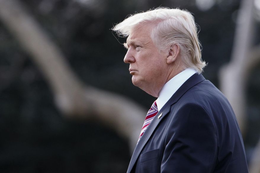 President Donald Trump walks to board Marine One on the South Lawn of the White House in Washington, Thursday, Jan. 26, 2107, for a short trip to Andrews Air Force Base, Md., then onto Philadelphia to speak at the Republican Congressional retreat. (AP Photo/Evan Vucci)