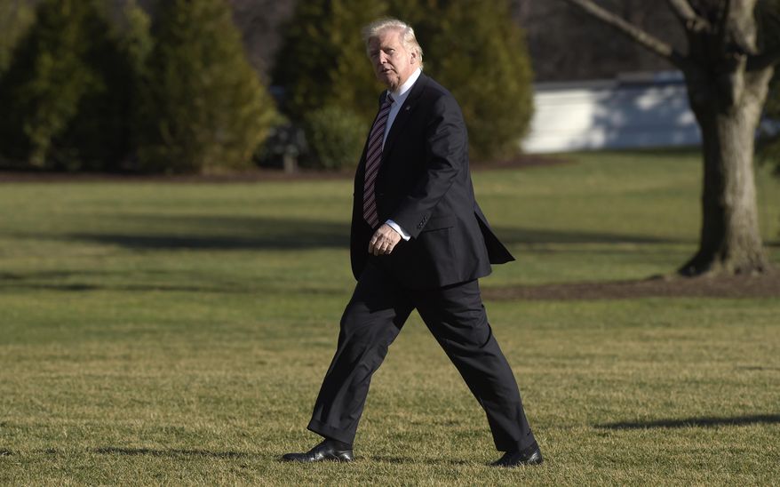 President Donald Trump walks on the South Lawn of the White House in Washington, Thursday, Jan. 26, 2017, after returning from a trip to Philadelphia. (AP Photo/Susan Walsh)