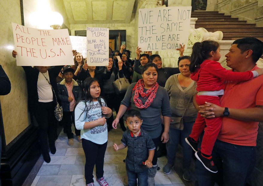 Immigrants, civil rights supporters, auto union members and immigrant rights advocates participate in a immigrant rights rally at the Capitol in Jackson, Miss., Wednesday, Jan. 25, 2017. Participants called on lawmakers to resist possible new immigration regulations that might be proposed by the Trump Administration. (AP Photo/Rogelio V. Solis)
