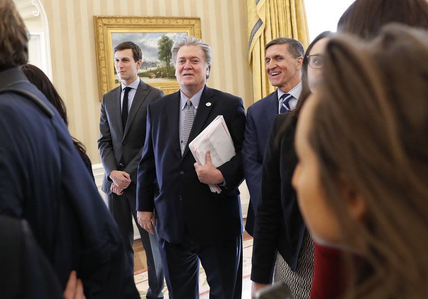 From left, White House Senior Advisers Jared Kushner, Steve Bannon and National Security Adviser Michael Flynn are seen in the Oval Office of the White House in Washington, Friday, Jan. 27, 2017, during a meeting between President Donald Trump and British Prime Minister Theresa May. (AP Photo/Pablo Martinez Monsivais)