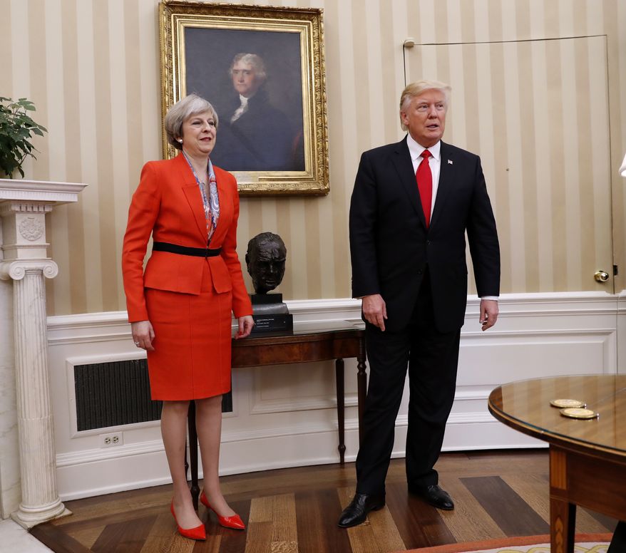 President Donald Trump and British Prime Minister Theresa May, Friday, Jan. 27, 2017, stand in the Oval Office of the White House in Washington.  (AP Photo/Pablo Martinez Monsivais)