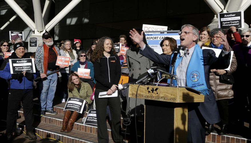 Congressman Earl Blumenauer, D-Ore., speaks to a crowd during a rally in Portland, Ore., Friday, Jan. 27, 2017. Several hundred supporters gathered with Oregon congressional leaders in protest against Education Secretary nominee Betsy DeVos. (AP Photo/Don Ryan)