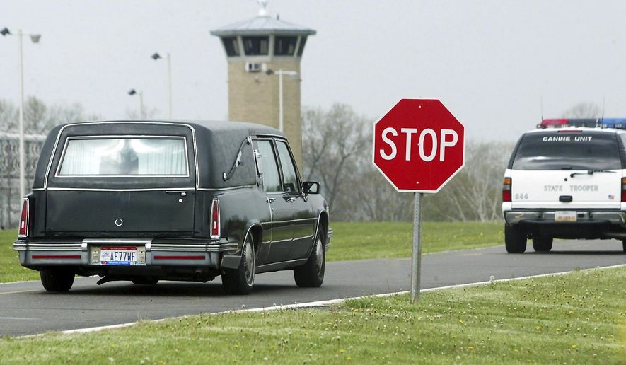 FILE – In this April 24, 2007, file photo, a hearse carries the body of James Filiaggi from Southern Ohio Correctional Facility in Lucasville, Ohio, following his execution for killing his ex-wife in 1994. Magistrate Judge Michael Merz in Dayton, Ohio, declared Ohio's new three-drug lethal injection process unconstitutional on Thursday, Jan. 26, 2017, and delayed three executions, including the execution of Ronald Phillips that had been scheduled Feb. 15, 2017. (AP Photo/Scott Osborne, File)