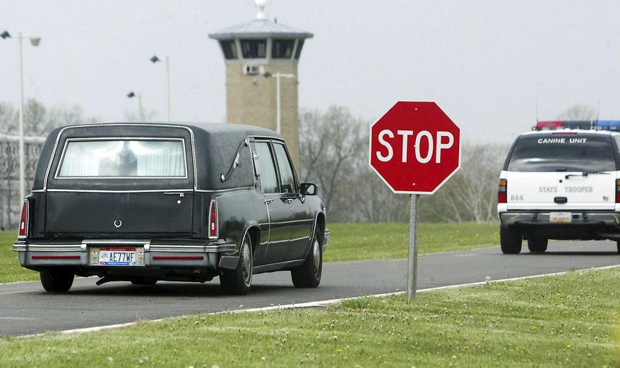 FILE – In this April 24, 2007, file photo, a hearse carries the body of James Filiaggi from Southern Ohio Correctional Facility in Lucasville, Ohio, following his execution for killing his ex-wife in 1994. Magistrate Judge Michael Merz in Dayton, Ohio, declared Ohio's new three-drug lethal injection process unconstitutional on Thursday, Jan. 26, 2017, and delayed three executions, including the execution of Ronald Phillips that had been scheduled Feb. 15, 2017. (AP Photo/Scott Osborne, File)