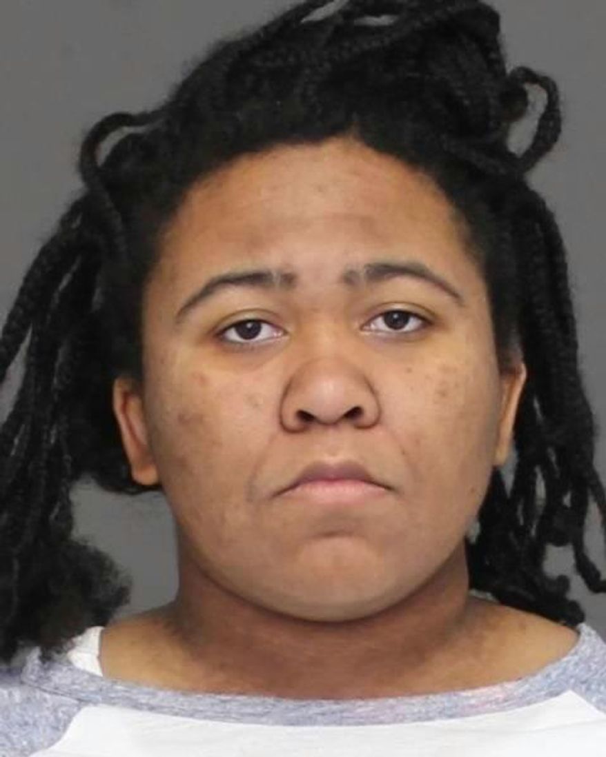 This Jan. 26, 2017 booking photo provided by Charles County, Maryland, Sheriff’s Office shows Bettih Shabazz in La Plata, Md. Shabazz, the granddaughter of Malcolm X, and her mother Malikah Shabazz, are charged with stealing a rental truck that was carrying seven pit bulls in what police say were inhumane conditions. Malikah Shabazz is also charged with animal cruelty. (Charles County, Maryland, Sheriff’s Office via AP)