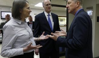Sue Graham, left, and her husband John Graham, center, talk with Virginia Secretary of Public Safety and Homeland Security Brian Moran, right, in the General Assembly Building in Richmond, Va. Friday, Jan. 27, 2017. The Grahams, parents of slain University of Virginia student Hannah Graham, were visiting the Capitol to meet with legislators, including House Speaker William J. Howell, R-Stafford. (Bob Brown/Richmond Times-Dispatch via AP)