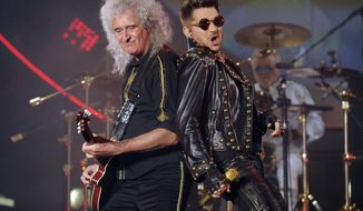 FILE - In this July 3, 2014 file photo Brian May of Queen, left, and Adam Lambert perform in Los Angeles. Queen has clearly found somebody to love in Lambert.Since joining forces with the “American Idol” runner-up for a series of shows in 2012, the band that ruled rock radio in the 1970s and early ‘80s has enjoyed tremendous success, with audiences embracing Lambert as the heir to Freddie Mercury’s onstage legacy. They’ve been selling out areas around the world for five years now, and have just announced a 25-city North American tour beginning June 23, 2017, in Phoenix.  (Photo by Chris Pizzello/Invision/AP, File)