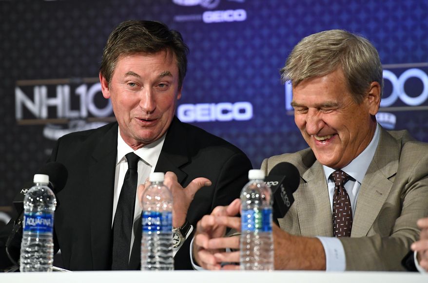 Wayne Gretzky, left, points to Bobby Orr during a news conference prior to an NHL 100 ceremony, Friday, Jan. 27, 2017, in Los Angeles. (AP Photo/Mark J. Terrill)