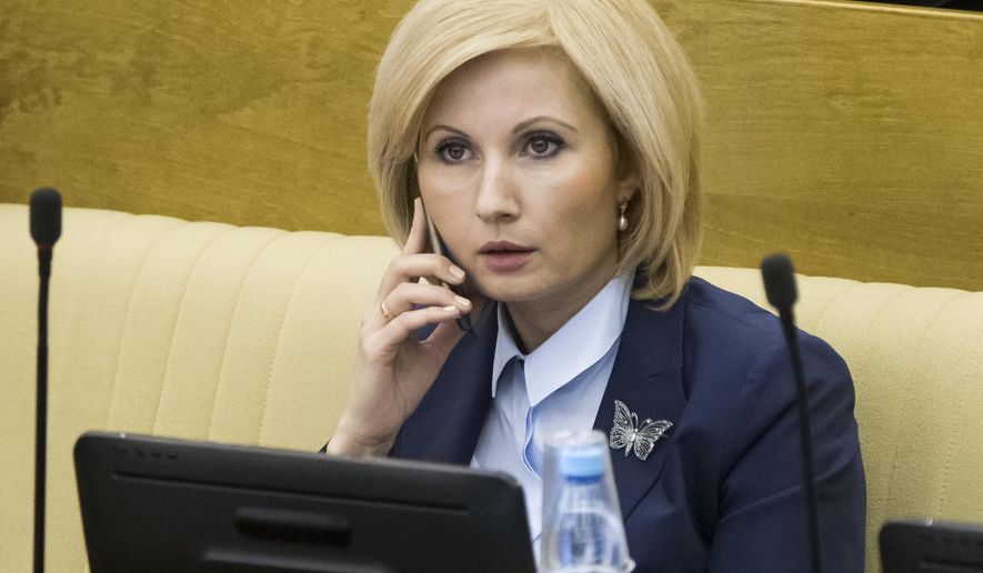 Russian lawmaker Olga Batalina, one of the bill&#x27;s co-authors rejected suggestions that the bill would sow impunity for those who beat up their families, speaks on a phone at the State Duma (lower parliament house) in Moscow, Russia, Friday, Jan. 27, 2017. The State Duma voted 380-3 Friday to eliminate criminal liability for battery on family members that doesn&#x27;t cause bodily harm, making it punishable by a fine or a 15-day day arrest. (AP Photo/Alexander Zemlianichenko)