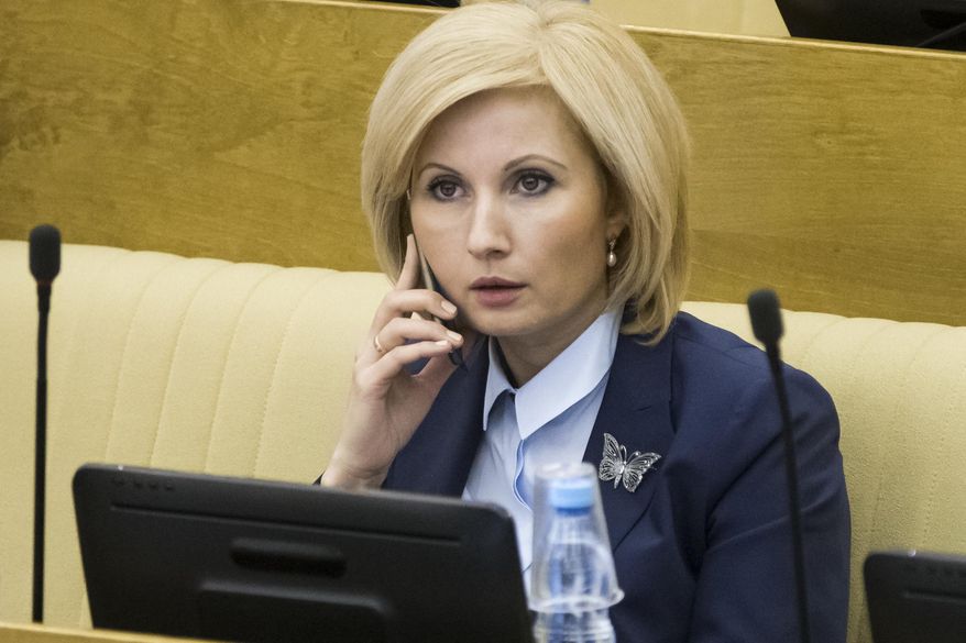 Russian lawmaker Olga Batalina, one of the bill&#x27;s co-authors rejected suggestions that the bill would sow impunity for those who beat up their families, speaks on a phone at the State Duma (lower parliament house) in Moscow, Russia, Friday, Jan. 27, 2017. The State Duma voted 380-3 Friday to eliminate criminal liability for battery on family members that doesn&#x27;t cause bodily harm, making it punishable by a fine or a 15-day day arrest. (AP Photo/Alexander Zemlianichenko)