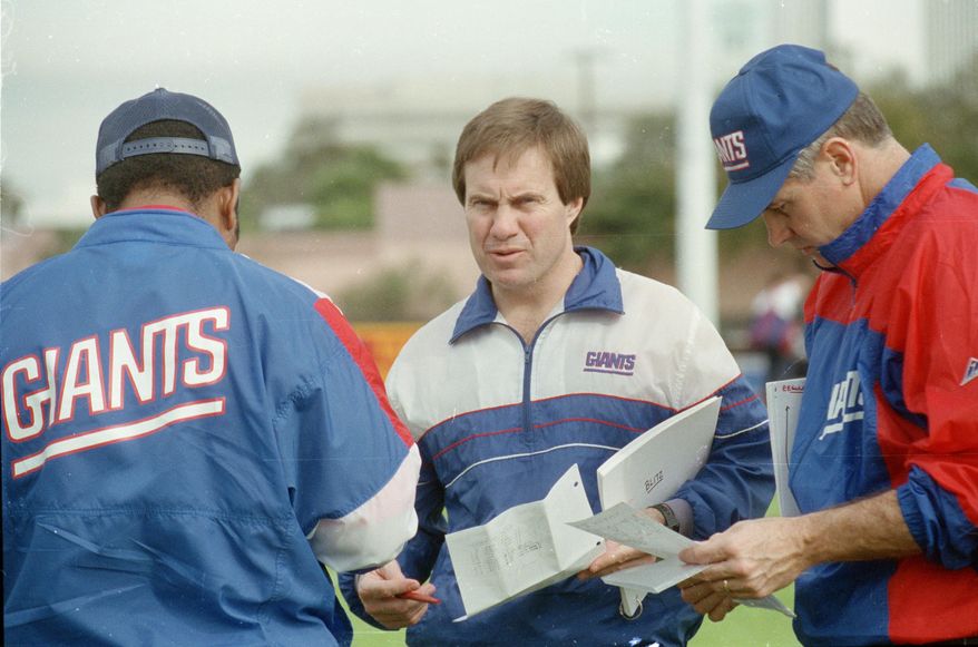 FILE - In this Jan. 23, 1991, file photo, New York Giants defensive coordinator Bill Belichick, center, goes over the defensive game plan with other coaches as they prepare for Super Bowl 25 against the Buffalo Bills, in Tampa, Fla. The Giants defeated the Bills 20-19 in Super Bowl 25 on Jan. 25, 1991. The top "D" almost always prevails against the top "O," going 5-1 so far when those teams meet to determine a champion _ even though each offense was led by a quarterback who is in the Pro Football Hall of Fame (or, in the most recent case, is expected to be). (AP Photo/File) **FILE**