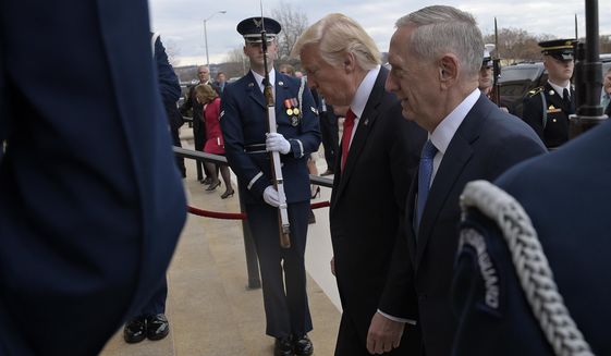 Defense Secretary James Mattis (right) was caught off guard by President Trump&#39;s Twitter announcement on July 26 that the military would renew its ban on transgender troops. (Associated Press/File)
