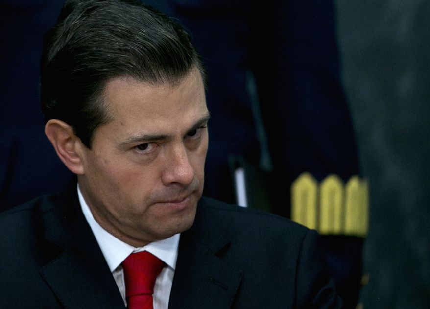 FILE - In this Jan. 23, 2017 file photo, Mexico&#39;s President Enrique Pena Nieto pause during a news conference at the Los Pinos presidential residence in Mexico City. (AP Photo/Marco Ugarte)