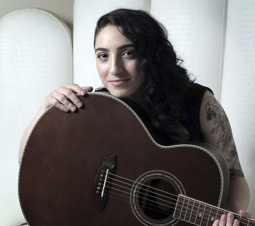 This photo taken Jan. 20, 2017, in Miami shows Emily Estefan. The daughter of Gloria & Emilio releases her debut album on Feb. 3, 2017, a day after her Festival Miami performance. Emily wrote a song featured in her parents' Broadway musical, On Your Feet, and has her own, edgier, contemporary sound. (José A. Iglesias/El Nuevo Herald via AP)