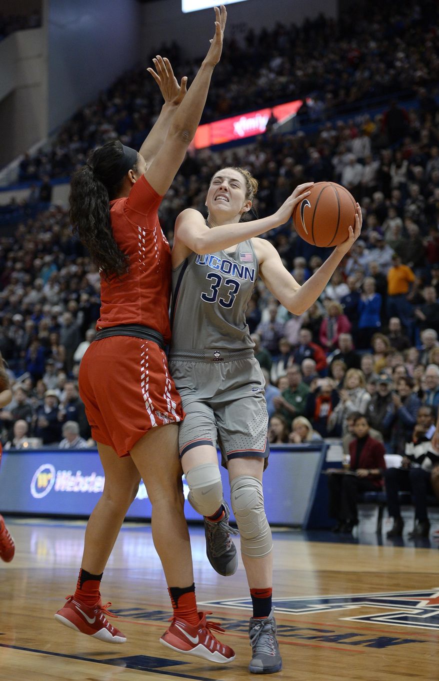 Connecticut&#39;s Katie Lou Samuelson drives around Houston&#39;s Brianne Coffman, left, in the half of an NCAA college basketball game, Saturday, Jan. 28, 2017, in Hartford, Conn. (AP Photo/Jessica Hill)