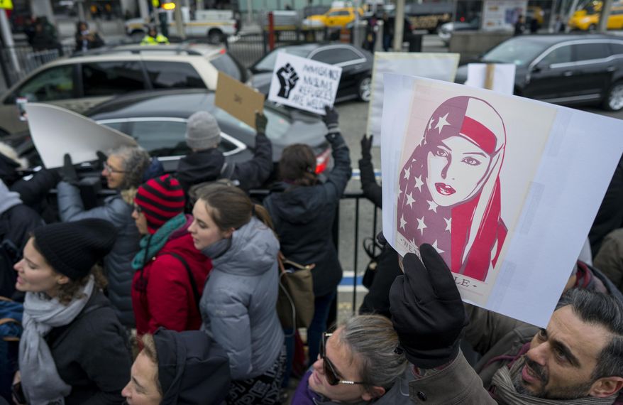 Protesters assemble at John F. Kennedy International Airport in New York, Saturday, Jan. 28, 2017 after two Iraqi refugees were detained while trying to enter the country. On Friday, Jan. 27, President Donald Trump signed an executive order suspending all immigration from countries with terrorism concerns for 90 days. Countries included in the ban are Iraq, Syria, Iran, Sudan, Libya, Somalia and Yemen, which are all Muslim-majority nations. (AP Photo/Craig Ruttle)