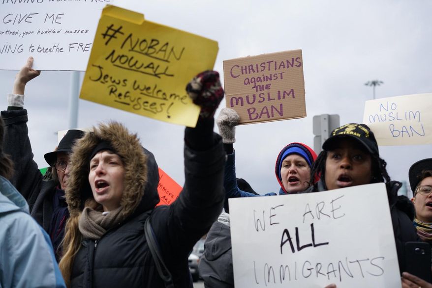 Protesters assemble at John F. Kennedy International Airport in New York, Saturday, Jan. 28, 2017 after two Iraqi refugees were detained while trying to enter the country. On Friday, Jan. 27, President Donald Trump signed an executive order suspending all immigration from countries with terrorism concerns for 90 days. Countries included in the ban are Iraq, Syria, Iran, Sudan, Libya, Somalia and Yemen, which are all Muslim-majority nations. (AP Photo/Craig Ruttle)