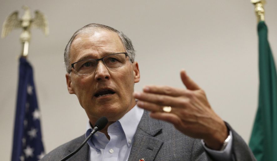Gov. Jay Inslee speaks to the media in the Airport Office Building at Seattle-Tacoma International Airport, Saturday, Jan. 28, 2017. Inslee blasted President Donald Trump&#x27;s executive order banning people from certain Muslim-majority nations as &amp;quot;unjustifiable cruelty.&amp;quot; (Logan Riely/The Seattle Times via AP)