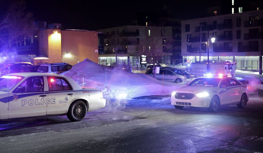 Police survey the scene after deadly shooting at a mosque in Quebec City, Canada, Sunday, Jan. 29, 2017. Quebec Premier Philippe Couillard termed the act "barbaric violence" and expressed solidarity with victims' families. (Francis Vachon/The Canadian Press via AP)