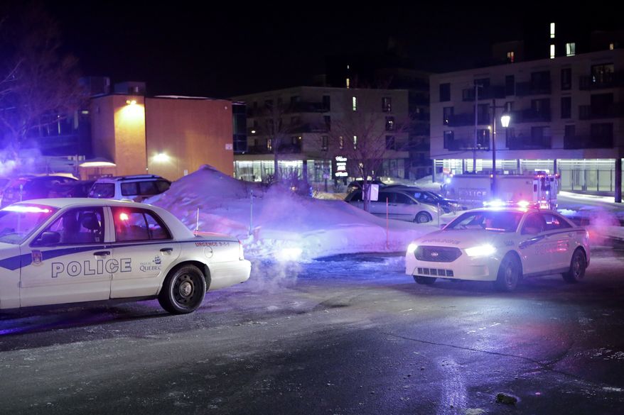 Police survey the scene after deadly shooting at a mosque in Quebec City, Canada, Sunday, Jan. 29, 2017. Quebec Premier Philippe Couillard termed the act "barbaric violence" and expressed solidarity with victims' families. (Francis Vachon/The Canadian Press via AP)