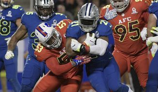 NFC strong safety Landon Collins (21), of the New York Giants is tackled by AFC linebacker Zach Brown (53), of the Buffalo Bills, during the first half of the NFL Pro Bowl football game Sunday, Jan. 29, 2017, in Orlando, Fla. (AP Photo/Phelan M Ebenhack)