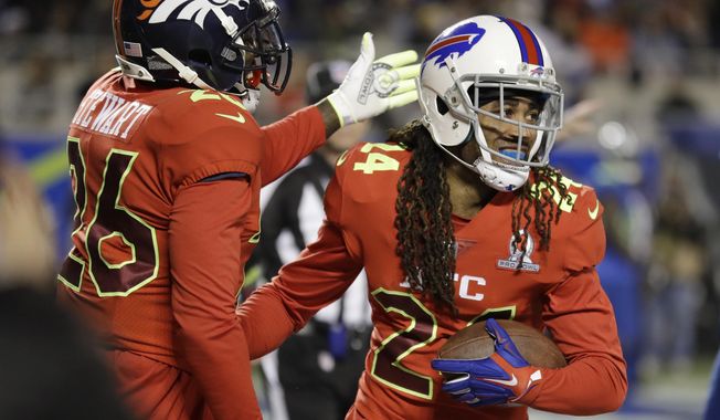 AFC strong safety Darian Stewart (26), of the Denver Broncos, congratulates cornerback Stephon Gilmore (24), of the Buffalo Bills, after Gilmore intercepted a pass in the end zone, during the first half of the NFL Pro Bowl football game Sunday, Jan. 29, 2017, in Orlando, Fla. (AP Photo/Chris O?Meara)