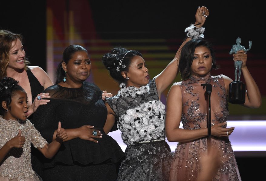 Taraji P. Henson, from right, Janelle Monae, Octavia Spencer, Kimberly Quinn, and Saniyya Sidney, foreground left, accept the award for outstanding performance by a cast in a motion picture for "Hidden Figures" at the 23rd annual Screen Actors Guild Awards at the Shrine Auditorium & Expo Hall on Sunday, Jan. 29, 2017, in Los Angeles. (Photo by Chris Pizzello/Invision/AP)