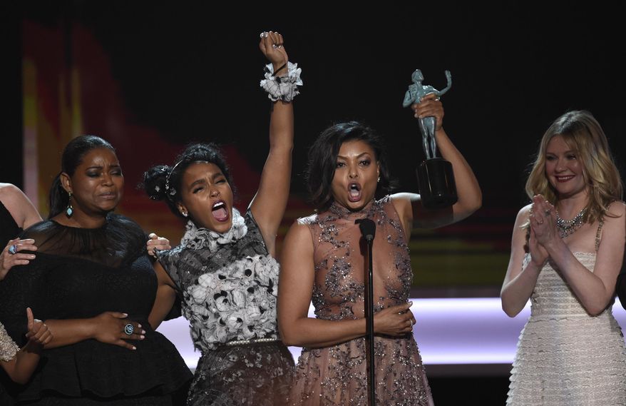 Octavia Spencer, from left, Janelle Monae, Taraji P. Henson, and Kirsten Dunst accept the award for outstanding performance by a cast in a motion picture for "Hidden Figures" at the 23rd annual Screen Actors Guild Awards at the Shrine Auditorium & Expo Hall on Sunday, Jan. 29, 2017, in Los Angeles. (Photo by Chris Pizzello/Invision/AP)