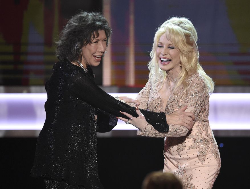 Dolly Parton, right, presents Lily Tomlin with the Lifetime Achievement Award at the 23rd annual Screen Actors Guild Awards at the Shrine Auditorium & Expo Hall on Sunday, Jan. 29, 2017, in Los Angeles. (Photo by Chris Pizzello/Invision/AP)