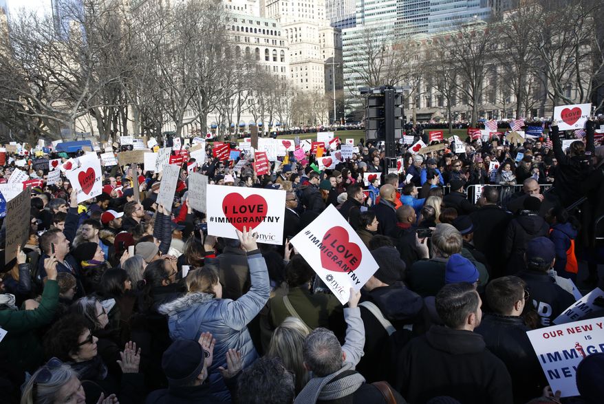Protesters and immigrants rights advocates gather at Castle Clinton National Monument, Sunday, Jan. 29, 2017, in New York's Battery Park, as President Donald Trump's immigration order sowed more chaos and outrage across the country. Travelers were detained at airports, while panicked families searched for relatives. These protesters joined others who registered their opposition to the president's sweeping measure that was blocked by several federal courts. (AP Photo/Kathy Willens)