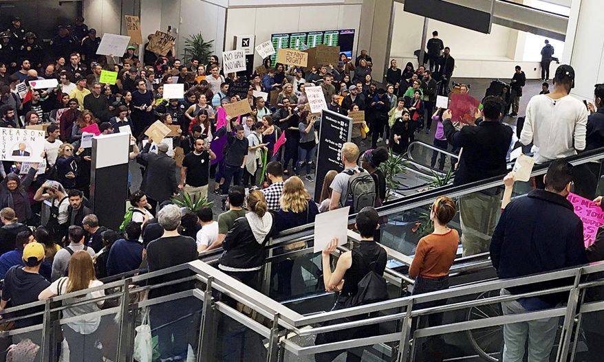 Demonstrators crowd the international terminal as people protest against President Donald Trump's executive order banning travel to the U.S. by citizens of several countries at San Francisco International Airport, Sunday, Jan. 29, 2017. (AP Photo/Olga Rodriguez)
