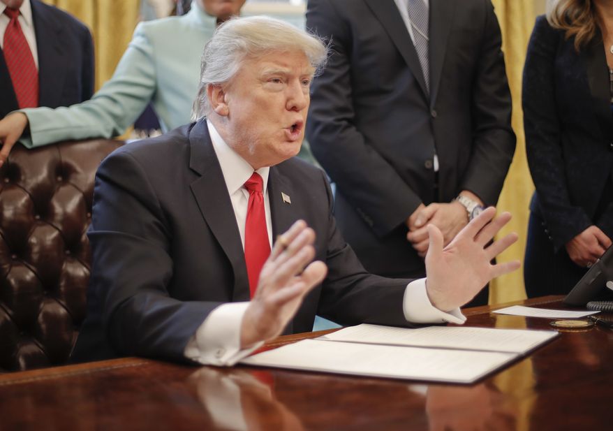 President Donald Trump speaks in the Oval Office of the White House in Washington, Monday, Jan. 30, 2017, before signing an executive order. Trump order is aimed at significantly cutting regulations. White House officials are calling the directive a &quot;one in, two out&quot; plan. It requires government agencies requesting a new regulations to identify two regulations they will cut from their own departments. (AP Photo/Pablo Martinez Monsivais)
