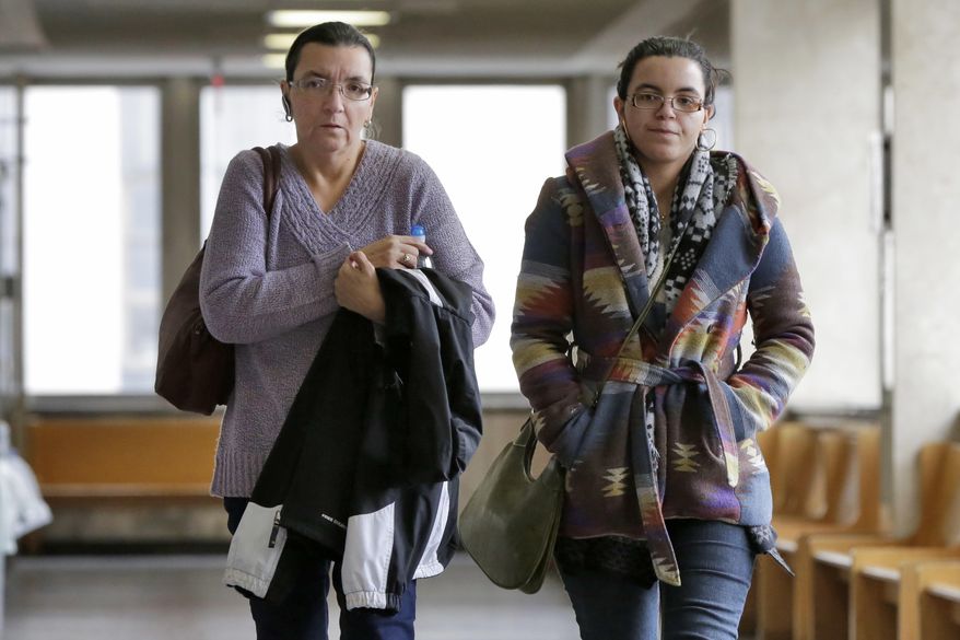 Rosemary Hernandez, left, wife of Pedro Hernandez, and his daughter Becky Hernandez, arrive at state Supreme Court, in New York, Monday, Jan. 30, 2017. The retrial of Hernandez, a man accused of killing 6-year-old Etan Patz in 1979, is ending with lawyers' summations. (AP Photo/Richard Drew)