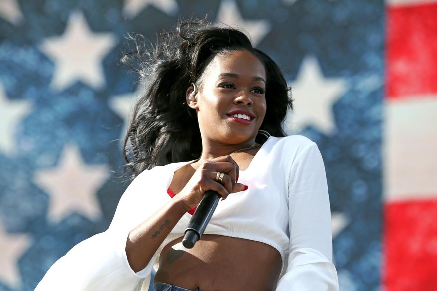 FILE - In this April 10, 2015, file photo, Azealia Banks performs at the 2015 Coachella Music and Arts Festival in Indio, Calif. Banks called out the Barbados-born singer Rihanna after the singer tweeted on Jan. 28, 2017: “Disgusted! The news is devastating! America is being ruined right before our eyes!” The tweet was a response to President Donald Trump’s order to temporarily suspend immigration from seven Muslim majority nations. (Photo by Rich Fury/Invision/AP, File)