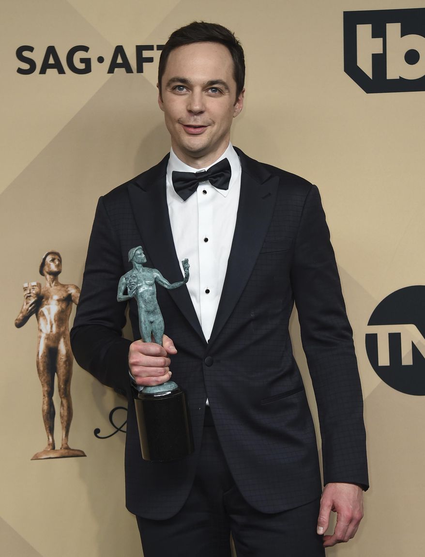 Jim Parsons poses in the press room with the awards for outstanding performance by a cast in a motion picture for "Hidden Figures" at the 23rd annual Screen Actors Guild Awards at the Shrine Auditorium & Expo Hall on Sunday, Jan. 29, 2017, in Los Angeles. (Photo by Jordan Strauss/Invision/AP)