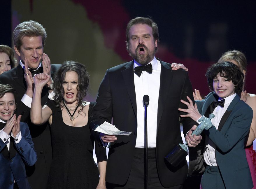 David Harbour and the cast of "Stranger Things" accept the award for outstanding performance by an ensemble in a drama series at the 23rd annual Screen Actors Guild Awards at the Shrine Auditorium & Expo Hall on Sunday, Jan. 29, 2017, in Los Angeles. (Photo by Chris Pizzello/Invision/AP)