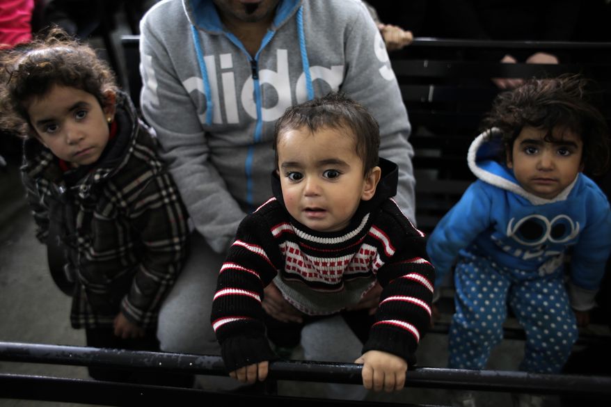 A Syrian family waits to register at the United Nations High Commissioner for Refugees headquarters, in Beirut, Lebanon, Monday, Jan. 30, 2017. By executive order, U.S. President Donald Trump imposed a 90-day ban, Friday, that affects travel to the U.S. by citizens of Iraq, Syria, Iran, Sudan, Libya, Somalia and Yemen and puts an indefinite hold on a program resettling Syrian refugees. (AP Photo/Hassan Ammar)